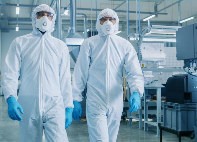 two professionals in hazmat suits